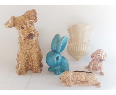 A collection of Sylvac items to include a large light brown terrier
&nbsp;2 smaller dogs a blue Sylvac rabbit and a wall pock
