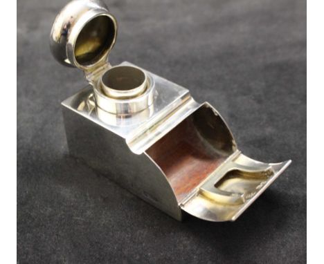 An Edwardian silver rectangular inkwell/stamp box with domed hinged cover, pen rest, hinged fall front opening to reveal a st