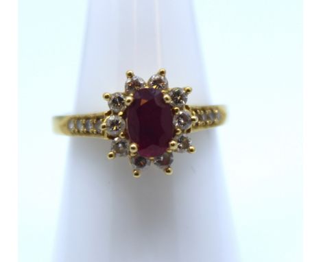 18ct Gold Ruby and Diamond cluster ring.&nbsp;
The oval brilliant cut ruby is 7mm x 5mm.&nbsp;
There are ten round brilliant 