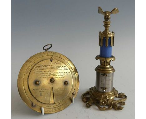 An early 20th century Negretti &amp; Zambra brass weather forecaster, patented in 1915 No.6276, the circular frame having two