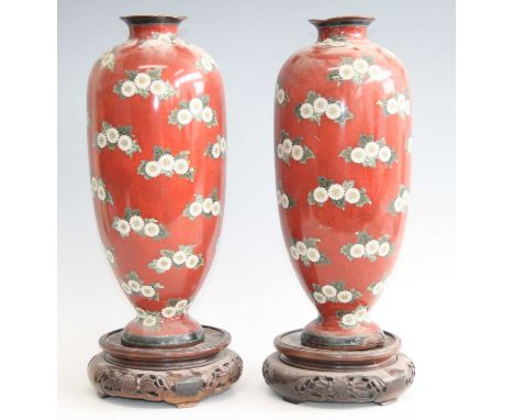 A pair of large Japanese cloisonné vases, each having an everted rim to a tapering body and domed foot, enamel decorated with