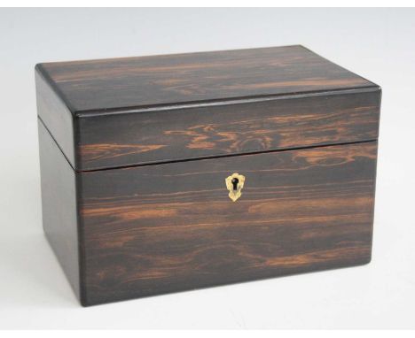 A Victorian coromandel fitted tea caddy, the hinged cover opening to reveal twin fitted hinged compartments, w.21.5cm 