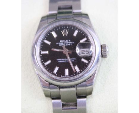 A lady's steel cased automatic Rolex Oyster Perpetual datejust chronometer, having signed black dial with luminous baton mark