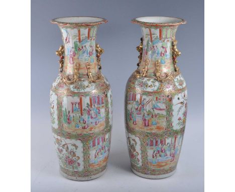 A pair of 19th century Chinese Canton famille rose porcelain floor vases, of baluster form, each enamel decorated with cartou
