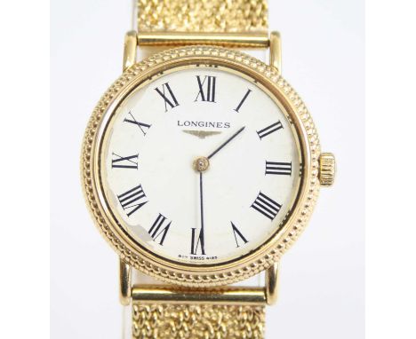 An 18ct yellow gold manual wind lady's Longines wristwatch, having a round white Roman dial and fitted to a Milanese style te