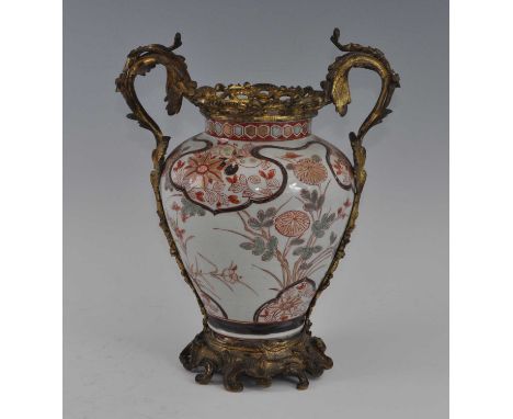 A Japanese Meiji period Imari porcelain vase, having European Rococo gilt metal mounts, enamel decorated with chrysanthemums,