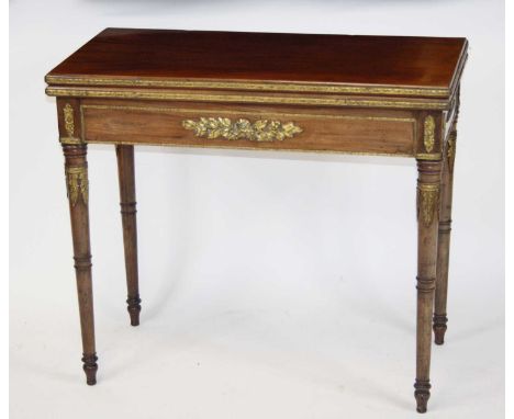A 19th century French walnut card table, having a rectangular fold-over top with green baize lined playing surface, raised on