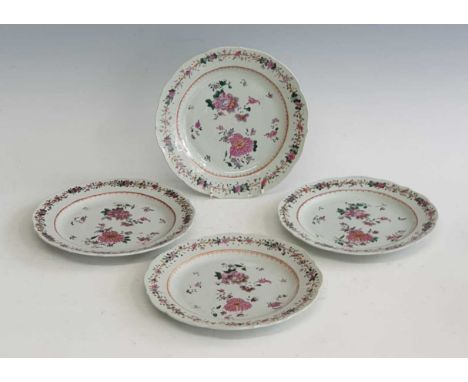 A set of four 18th century Chinese export famille rose porcelain plates, gilt and enamel decorated with flowers within a spea