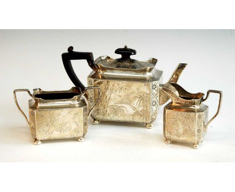 A Victorian silver three-piece tea set, comprising teapot, twin handled sugar and cream, each piece profusely chased in the J