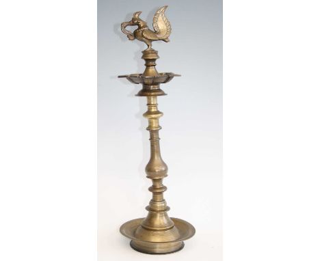 A cast brass Hindu votive oil lamp, the sconce surmounted by a detachable Hamsa bird with incised calligraphy to the undersid