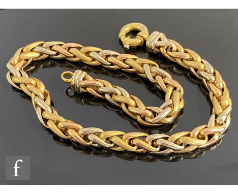 An 18ct three coloured gold necklet with intertwined alternating links terminating in a large bolt ring fastener, weight 53g,