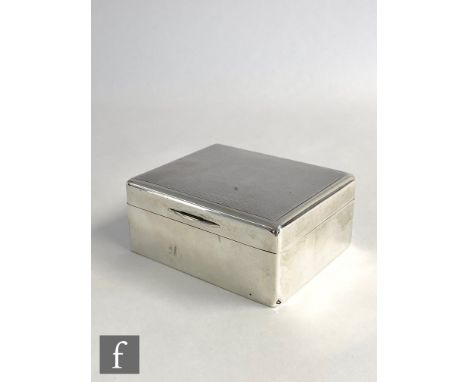 A hallmarked silver rectangular cigarette box with engine turned decoration to hinged lid, length 11cm, London 1922, Mappin &