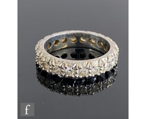 An 18ct white gold diamond full eternity ring comprising twenty brilliant cut stones each approximately 0.05ct, weight 5.9g, 