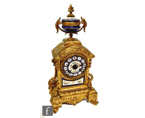 A late 19th century French mantle porcelain and gilt metal mantle clock, eight day striking movement, the case surmounted wit