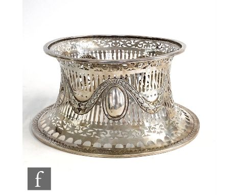 A hallmarked Britannia silver dish ring, with embossed swag detailing and oval roundels, pierced gallery decoration, diameter