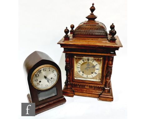 A late Victorian walnut cased mantle clock with eight day striking movement, silvered dial with brass corner spandrels, 54cm,