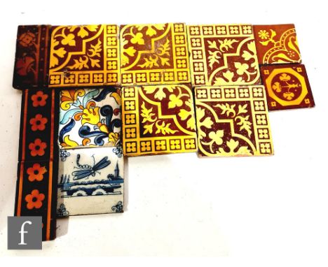 A set of four Victorian brown glazed pottery tiles in the Medieval style to form a 31cm square, a similar single tile, three 