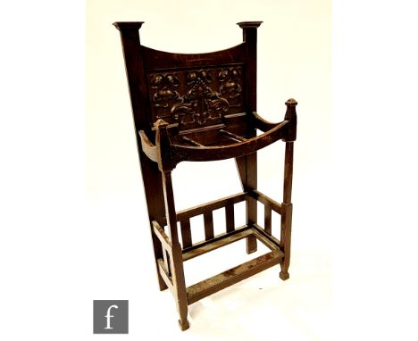 A Liberty style carved oak umbrella stand, height 110cm x depth 26cm x width 53cm, lacking drip tray.