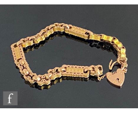 An early 20th Century rose gold fancy link bracelet terminating in padlock fastener, 20cm, weight 15g. 