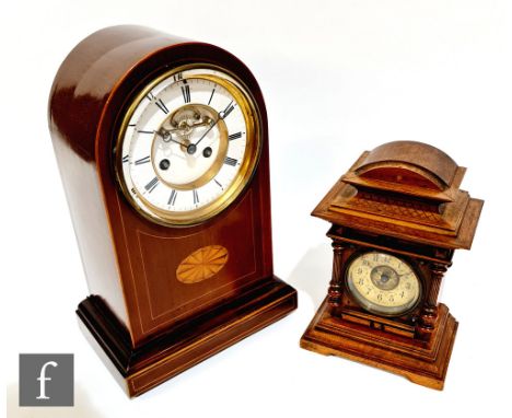 An Edwardian mahogany line inlaid bracket or mantel clock of stepped dome form, the white enamelled dial with Roman numerals 