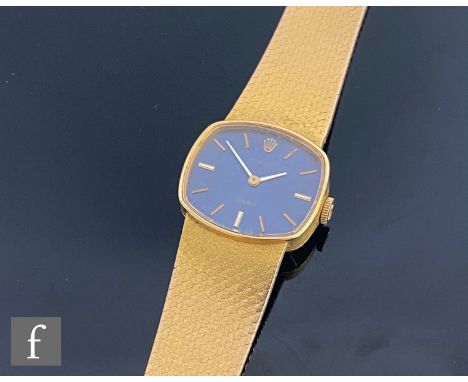 A mid 20th Century 18ct hallmarked lady's Rolex Orchid manual wrist watch, batons to a cushioned oval blue dial, case width 2