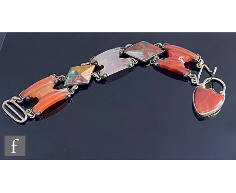 A 19th Century Scottish silver hardstone bracelet comprising two diamond shaped panels detailed with agates spaced by carneli