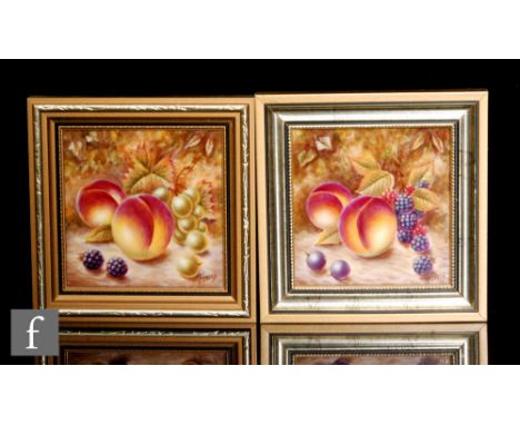 Two framed Fallen Fruits plaques decorated by A. Creed with hand painted peaches, blackberries and grapes, all in the style o