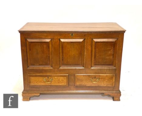 A George III oak and mahogany crossbanded mule chest, the triple fielded and chequer strung inlaid front over two drawers, on