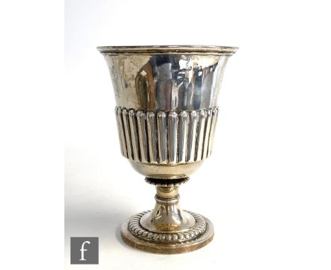 A Georgian hallmarked silver goblet, circular foot with part fluted embossed detail below conforming bucket bowl, height 15.5