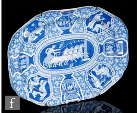 A large 19th Century blue and white meat plate decorated in the transfer printed Greek pattern with classical cartouche scene