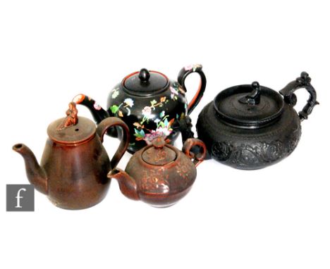 Four 19th Century teapots of varying form comprising a Wedgwood example in a Rockingham type brown glaze with Sybil/Widow fin