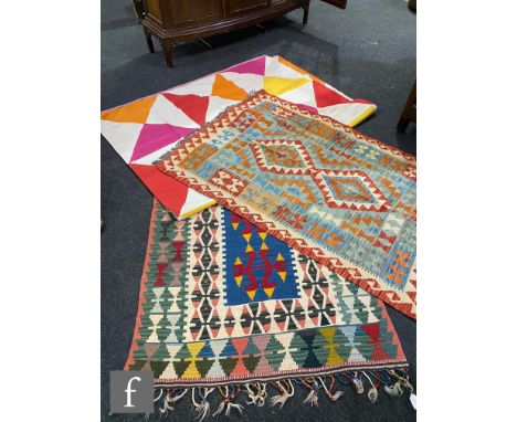 A Caucasian flat weave rug, double lozenge panel on a light blue ground within hooked border, 180cm x 103cm, and two similar 