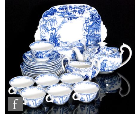 A 1930s Royal Crown Derby part teaset decorated in the blue and white New Mikado pattern, comprising a teapot, six cups and s