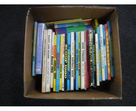 A box containing late 20th century boys and girls annuals, Harry Potter books etc