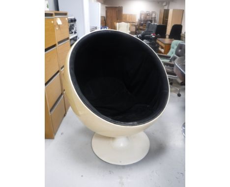 After Eero Aarnio - Ball (or Globe), a moulded chair with black upholstery on circular plinth with full swivel action. CONDIT