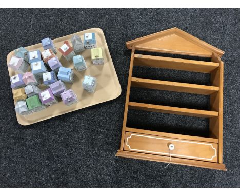 A wooden spice rack together with a set of twenty-four Spice Village spice pots