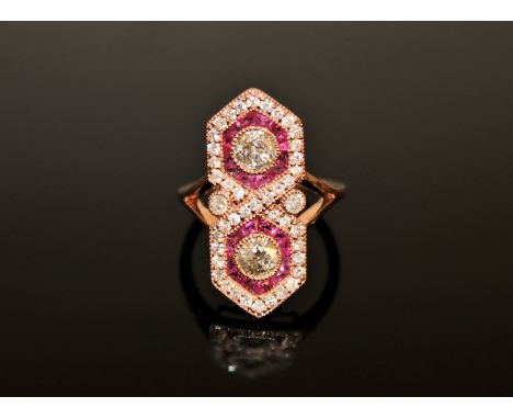 A 14ct rose gold ruby and diamond ring, with two brilliant-cut diamonds totalling 0.67 carat, of P2 clarity and I/J colour, f