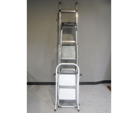 A bundle of garden tools together with four assorted sets of folding steps 