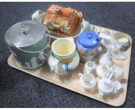 A tray containing Wedgwood plated biscuit barrel, Goss china, Beswick Art Deco jug, Price Brothers cottage ware butter dish a