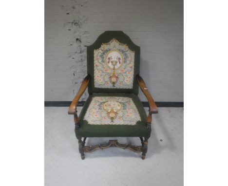 An early 20th century continental armchair upholstered in a tapestry fabric 