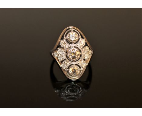 A 14ct white gold diamond ring, with three central brilliant-cut diamonds weighing 0.88 carat in total, of I2 clarity and G/H