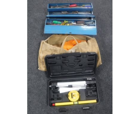A metal concertina tool box containing a large quantity of hand tools together with a canvas bag containing flame retardant c