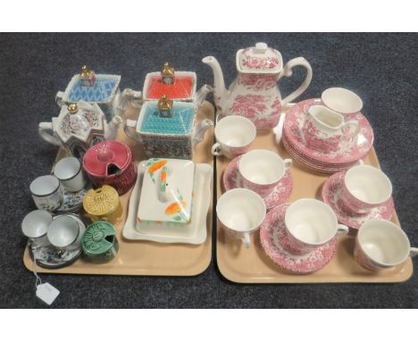 Two trays containing a Staffordshire ironstone twenty-one piece tea service together with four Sadler teapots, preserve pots,