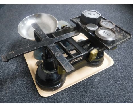 A large set of iron and brass post office scales with weights together with a set of kitchen scales