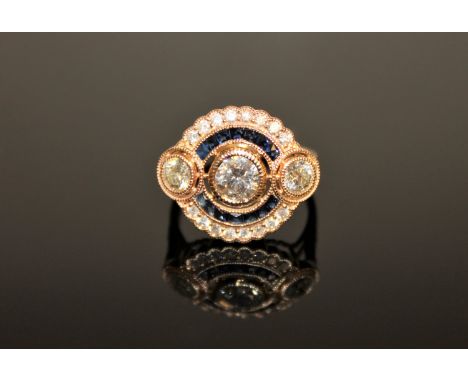 A 14ct yellow gold sapphire and diamond Art Deco style cluster ring, the central brilliant-cut diamond weighing 0.60 carat, c