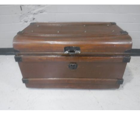 An early 20th century tin trunk 