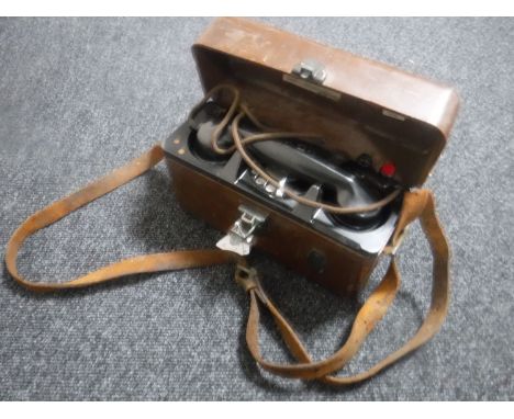 A vintage Bakelite post office engineer's telephone in case together with a vintage leather tool bag