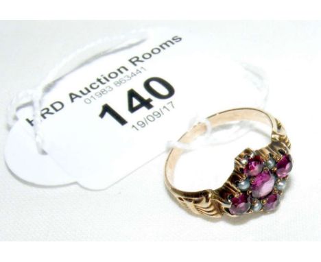 A 9ct yellow gold Edwardian style ruby and seed pearl cluster ring