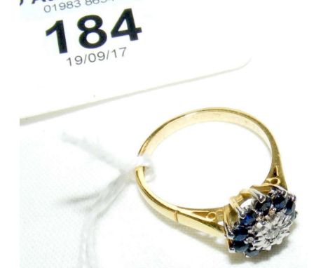 An 18ct yellow gold diamond and sapphire cluster ring