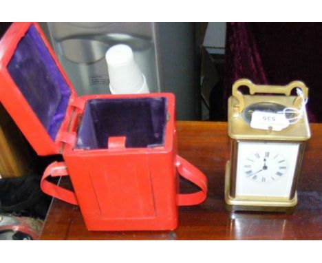 A 14cm high brass case repeater carriage clock in fitted travelling case
